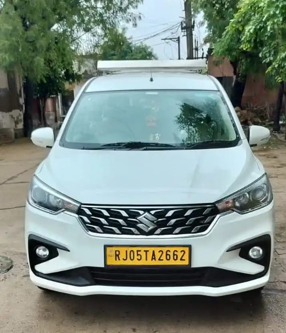Premium taxi SUV for Sharma Tour and Travels with Rajasthan destination backdrop